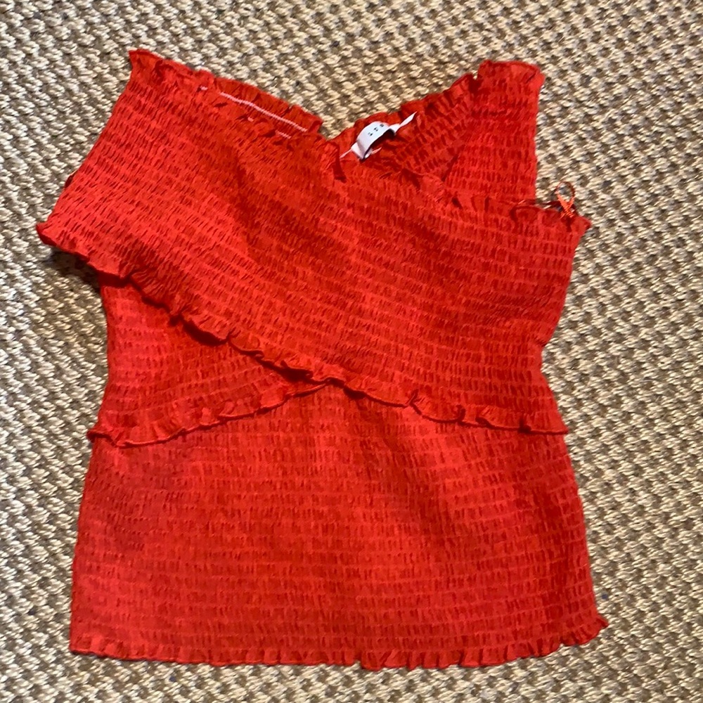 Lush top featuring off the shoulder sleeves